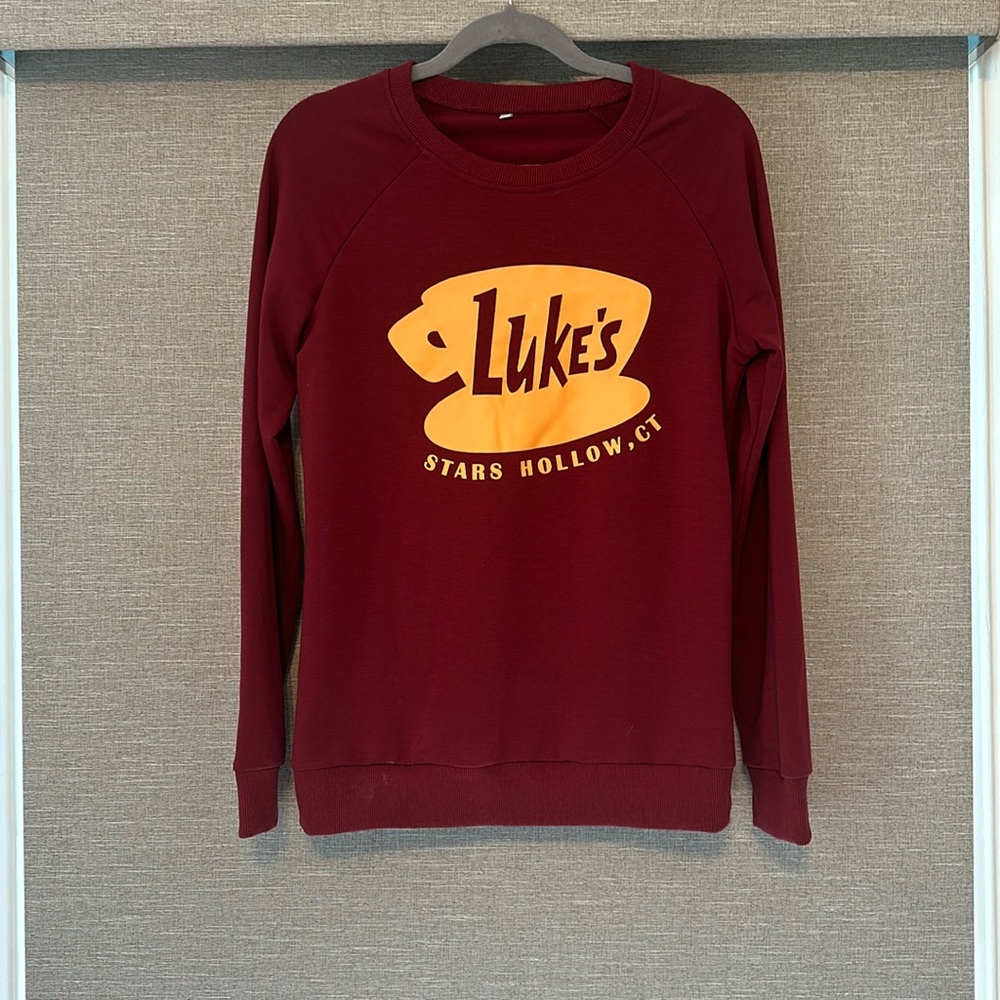 Gilmore Girls Luke’s diner sweatshirt.